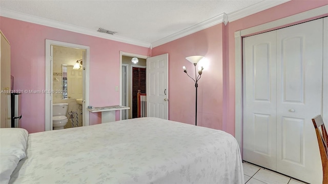 tiled bedroom with ensuite bath, ornamental molding, and a closet