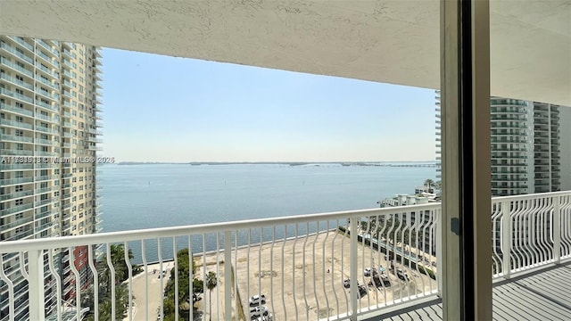 balcony featuring a water view