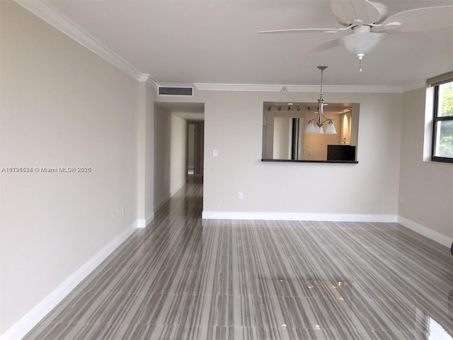 unfurnished living room featuring ornamental molding and ceiling fan