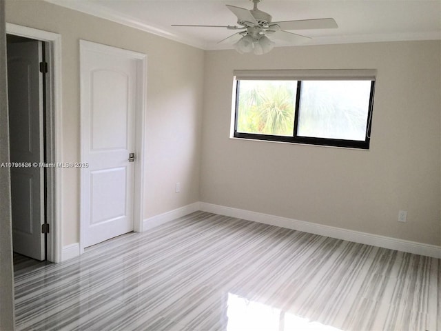 unfurnished room with light hardwood / wood-style flooring, ornamental molding, and ceiling fan