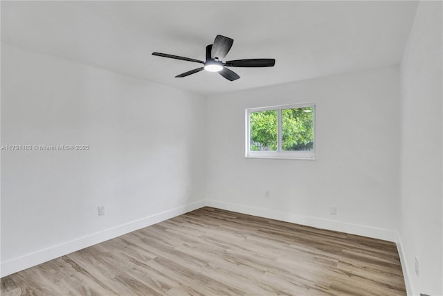 empty room with ceiling fan and light wood-type flooring