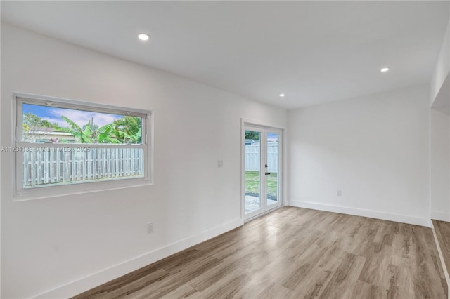 spare room featuring light wood-type flooring