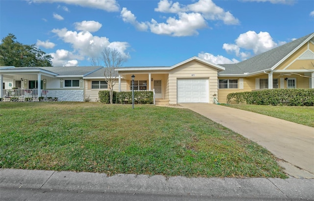 ranch-style home with a garage, a front yard, and covered porch