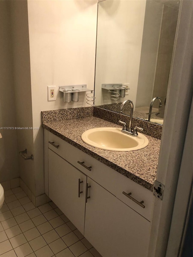 bathroom featuring vanity and tile patterned flooring