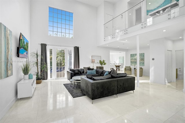 living room featuring a high ceiling