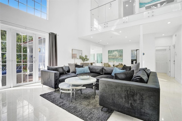 living room with french doors and a high ceiling