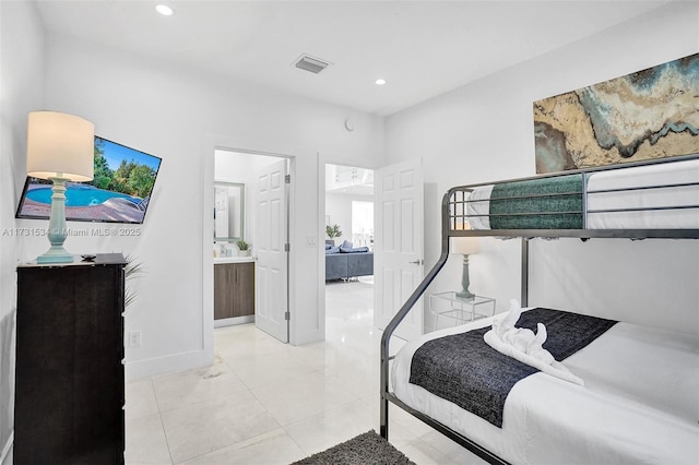 tiled bedroom with ensuite bath