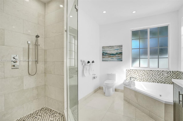 full bathroom with vanity, tile patterned floors, independent shower and bath, and toilet