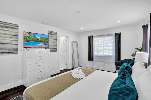 bedroom featuring dark wood-type flooring