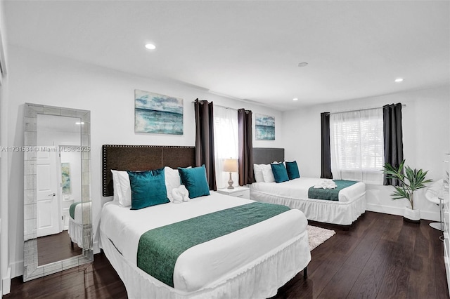 bedroom with dark wood-type flooring