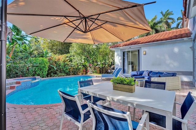 view of swimming pool with an outdoor living space, an in ground hot tub, and exterior bar