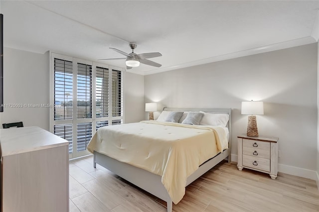 bedroom featuring light wood-type flooring, access to outside, and ceiling fan