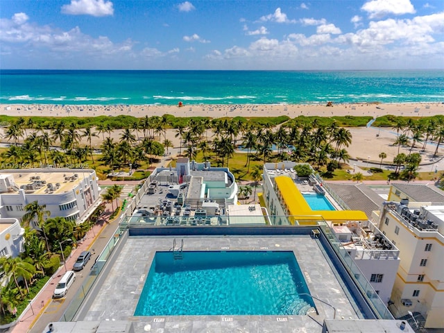 aerial view with a water view and a view of the beach