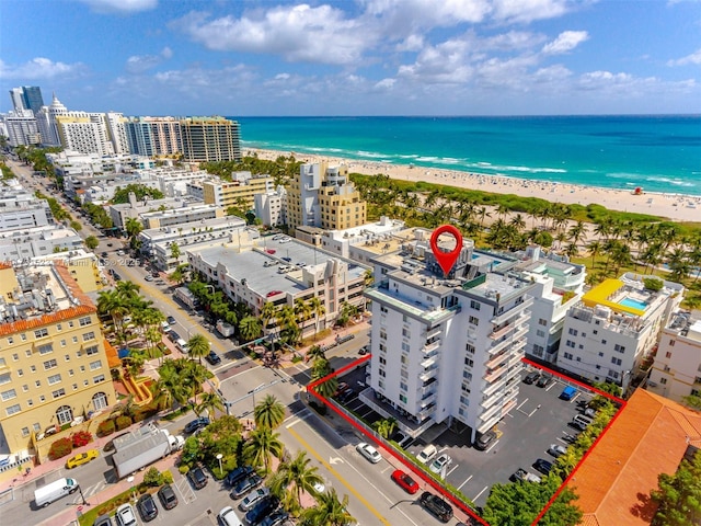 aerial view with a view of the beach and a water view