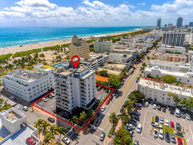 aerial view featuring a view of the beach and a water view