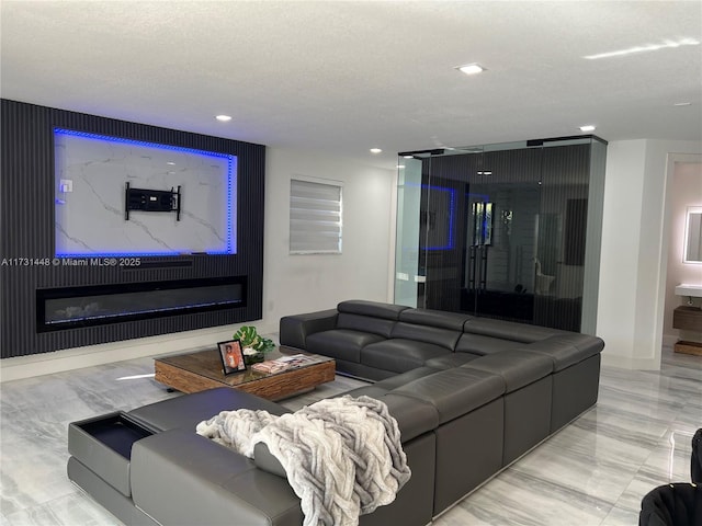 cinema room featuring a textured ceiling