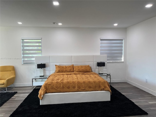 bedroom with hardwood / wood-style floors