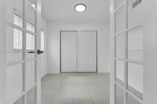 walk in closet featuring light tile patterned floors