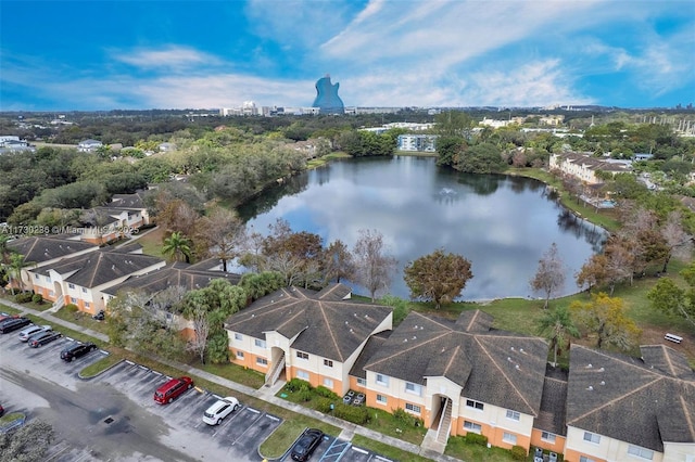 birds eye view of property with a water view