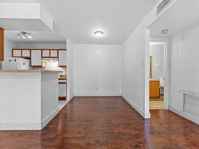 15315 SW 106th Ter Unit 423, Miami, FL 33196 - unfurnished living room featuring hardwood / wood-style flooring and baseboards