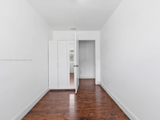 15315 SW 106th Ter Unit 423, Miami, FL 33196 - unfurnished bedroom with wood finished floors and baseboards
