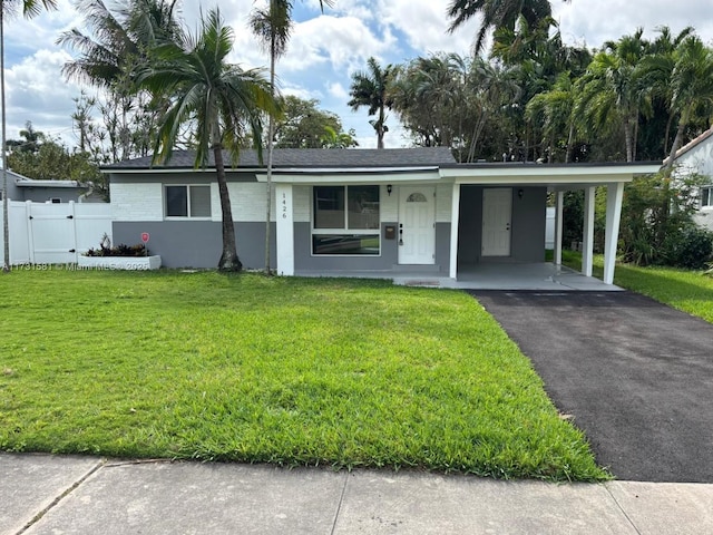 single story home featuring a gate, a front lawn, aphalt driveway, and an attached carport