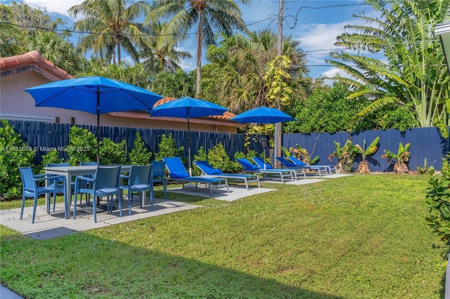 view of jungle gym with a yard and a patio area