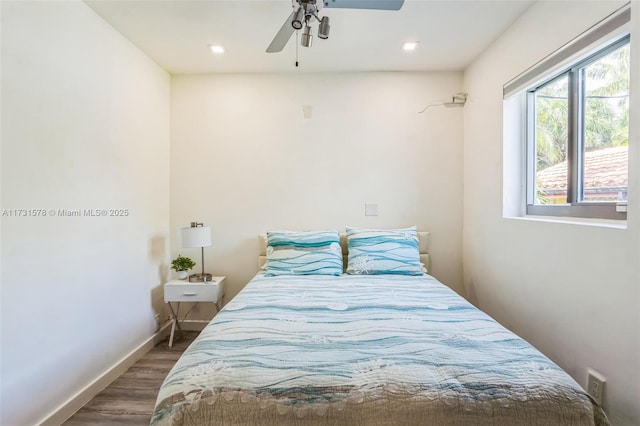 bedroom with dark wood-type flooring and ceiling fan