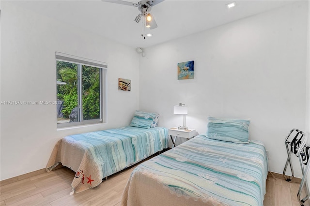 bedroom featuring ceiling fan and light hardwood / wood-style floors