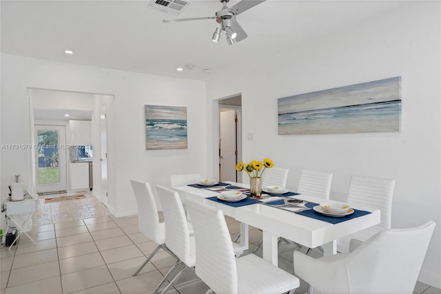 dining room with light tile patterned floors and ceiling fan