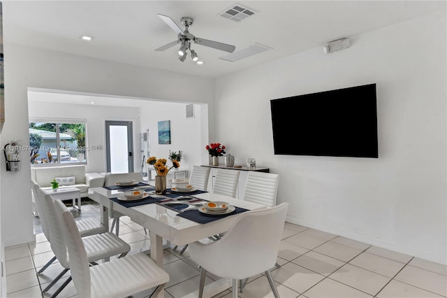 dining area with light tile patterned floors and ceiling fan