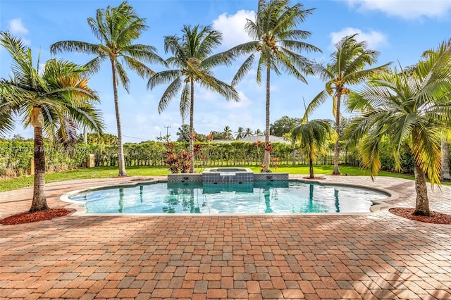 view of pool with an in ground hot tub