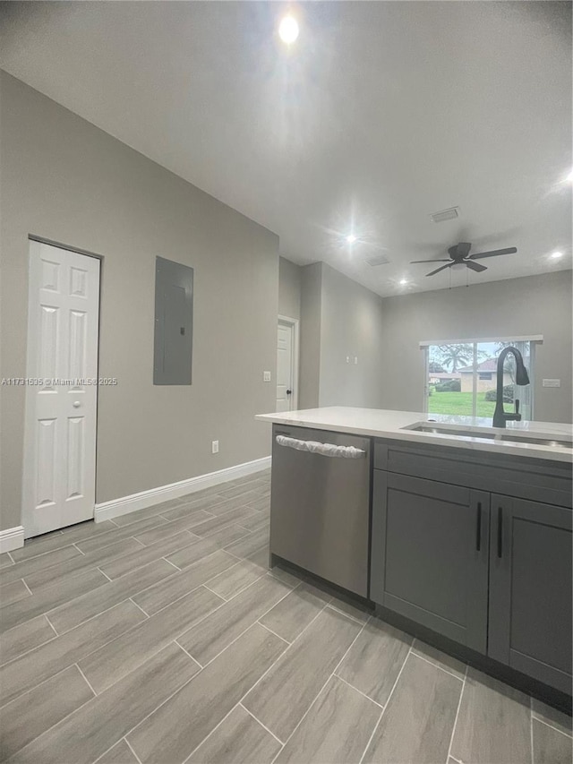 kitchen featuring sink, electric panel, dishwasher, and ceiling fan