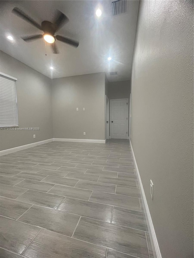 unfurnished room featuring ceiling fan