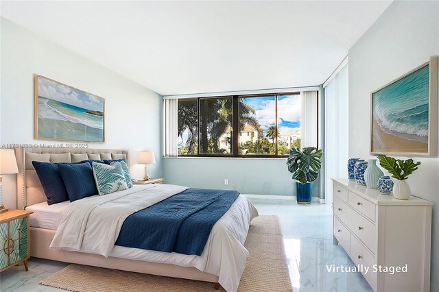 bedroom featuring floor to ceiling windows