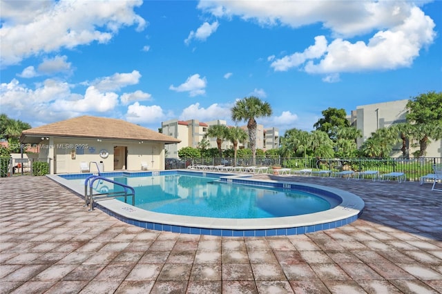 view of swimming pool with a patio area