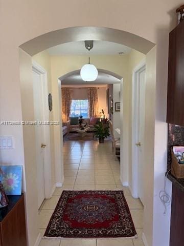 hallway with light tile patterned floors