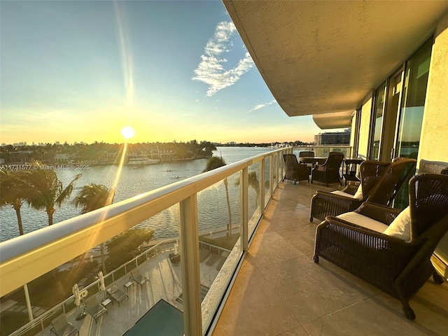 balcony at dusk with a water view