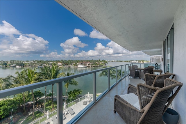 balcony featuring a water view