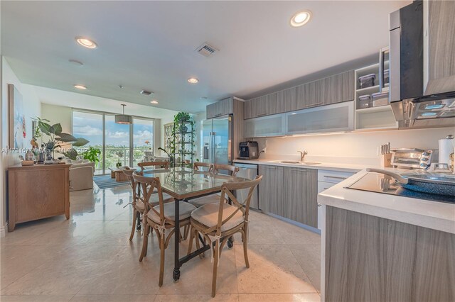 living room featuring a wall of windows and light tile patterned floors