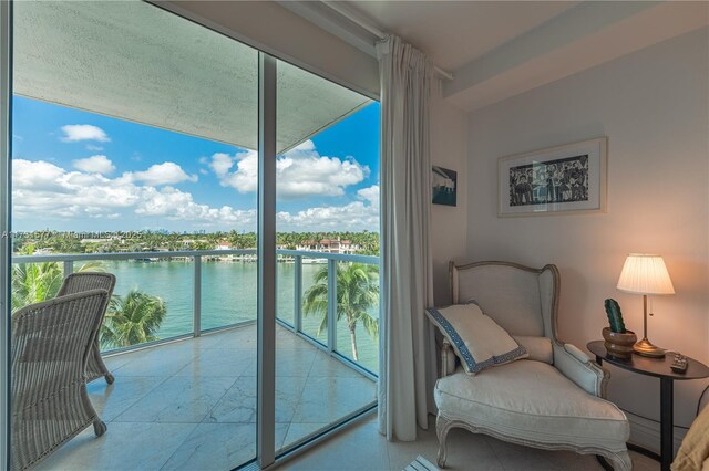 interior space with a wealth of natural light and a water view