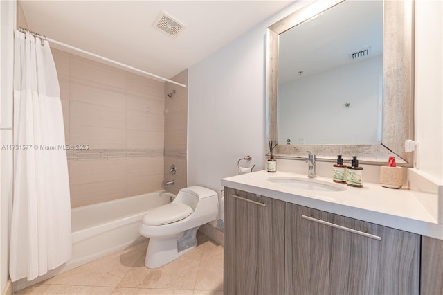 full bathroom featuring shower / bath combination with curtain, tile patterned floors, vanity, and toilet