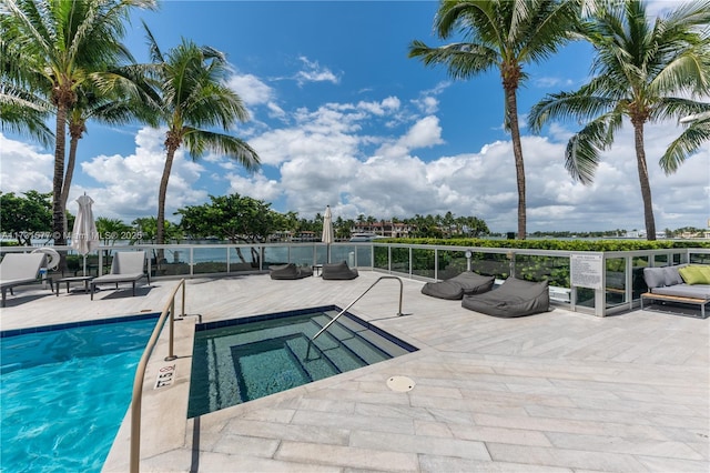 view of pool with a community hot tub and a patio area