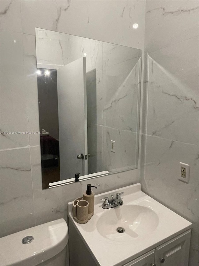 bathroom with vanity and toilet