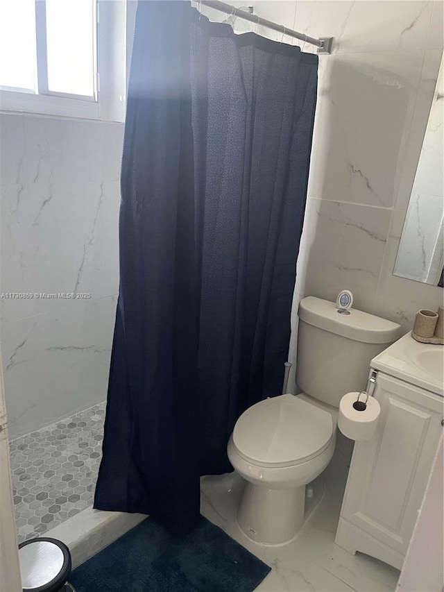 bathroom with vanity, toilet, and a shower with shower curtain