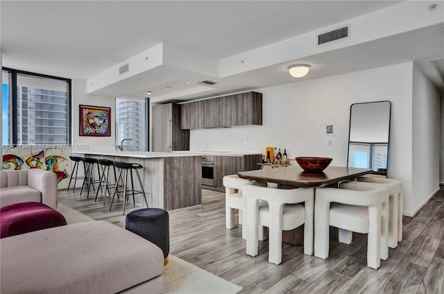 dining area with light hardwood / wood-style floors