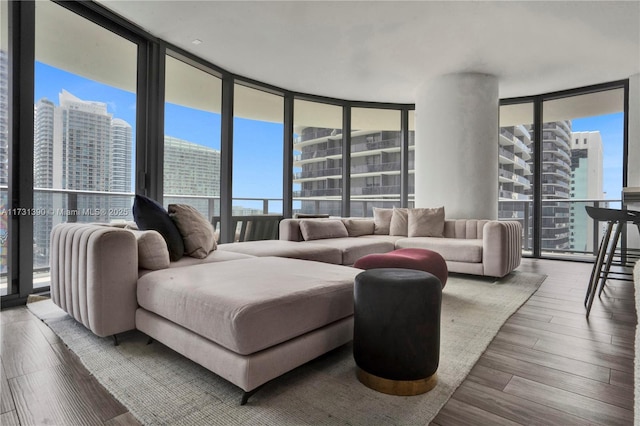 living room featuring floor to ceiling windows and hardwood / wood-style floors