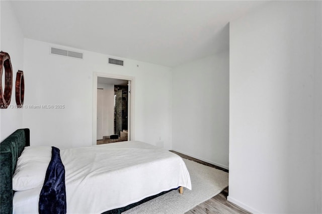 bedroom with light hardwood / wood-style flooring