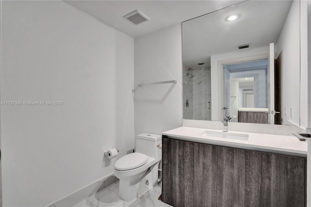 bathroom with walk in shower, vanity, and toilet