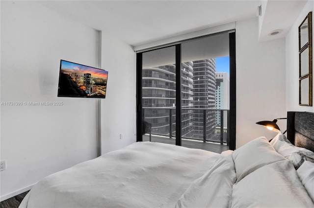 bedroom with floor to ceiling windows